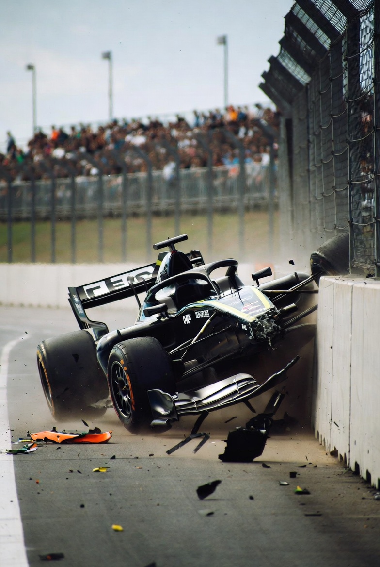 A Formula 1 car crashing into a concrete barrier at full speed, debris scattered across the track, illustrating what happens when strategic validation is skipped — unchecked speed without direction control ends in a costly, avoidable impact